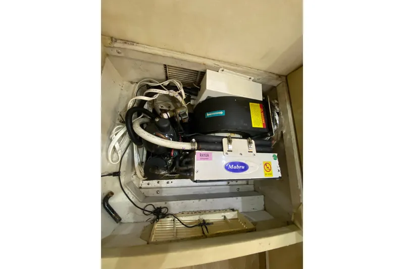 Slide: The Image of Engine compartment of a 1993 Wellcraft 4300 Portofino boat with Mabru equipment. - 46