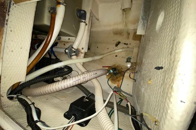 Slide: The Image of Interior view of 1993 Wellcraft 4300 Portofino boat showing plumbing and wiring components. - 48