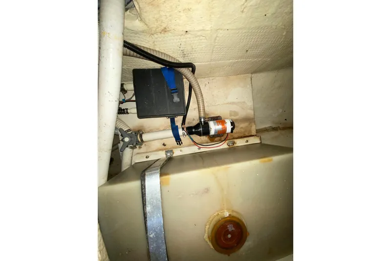 Slide: The Image of 1993 Wellcraft 4300 Portofino interior showing plumbing and electrical components. - 49