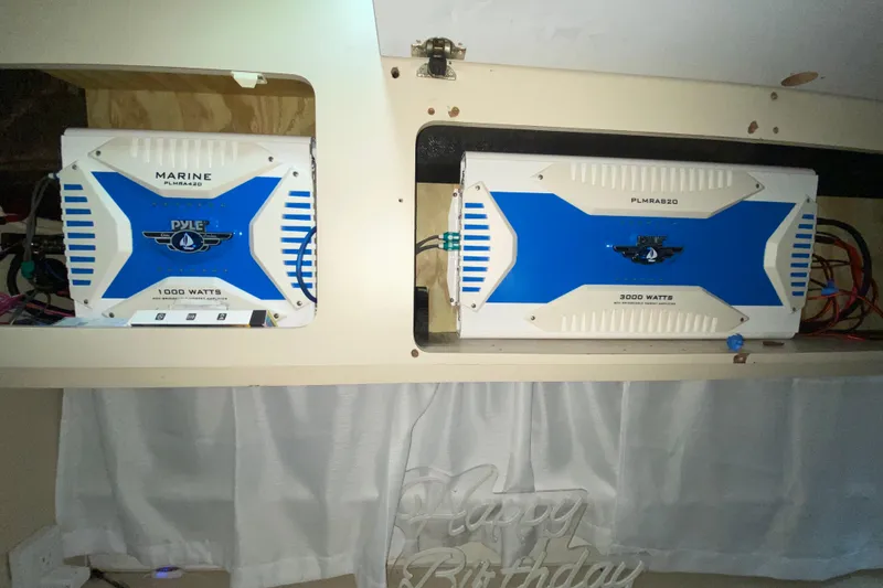 Slide: The Image of Marine amplifiers installed in a 1993 Wellcraft 4300 Portofino boat interior. - 50