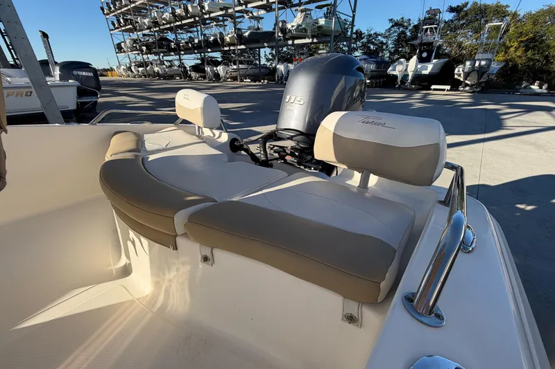 Slide: The Image of 2016 Pioneer 175 Bay Sport boat with Yamaha 115 engine, docked in a marina. - 18