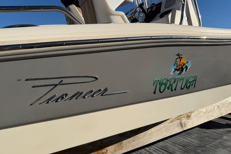 Slide: The Image of 2016 Pioneer 175 Bay Sport boat with "Tortuga" logo on the side. - 2