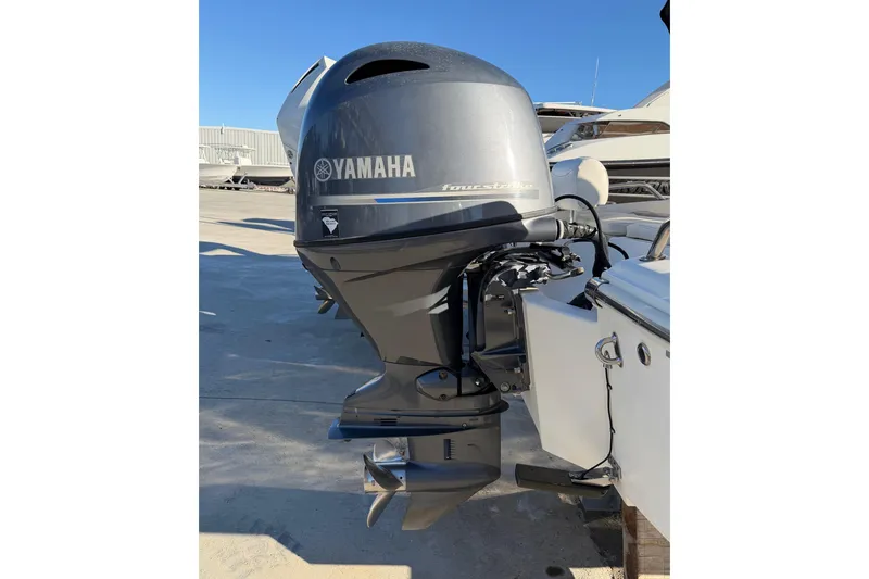 Slide: The Image of Yamaha outboard motor on 2016 Pioneer 175 Bay Sport boat, docked outdoors. - 21