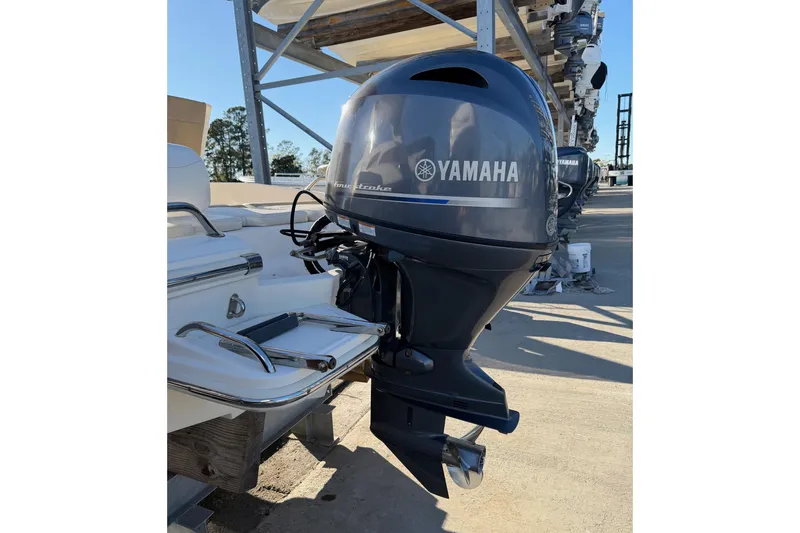 Slide: The Image of 2016 Pioneer 175 Bay Sport with Yamaha outboard motor in storage. - 22