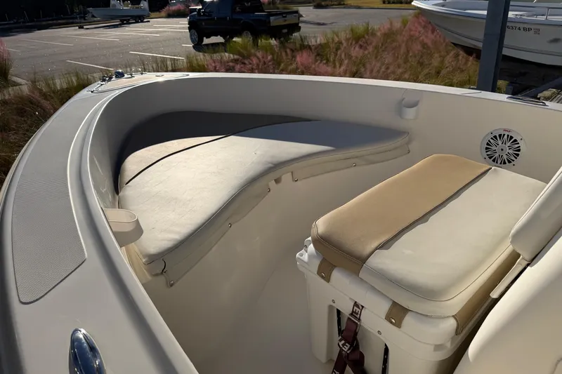 Slide: The Image of 2016 Pioneer 175 Bay Sport boat interior with cushioned seating and storage. - 8