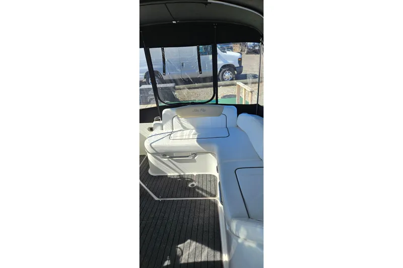 Slide: The Image of Interior view of 2009 Sea Ray 270 Sundancer boat with white seating. - 1