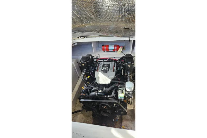 Slide: The Image of Engine compartment of a 2009 Sea Ray 270 Sundancer boat with visible fire extinguisher. - 13