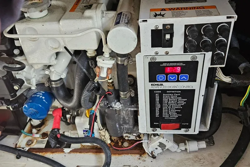 Slide: The Image of Engine compartment of a 2009 Sea Ray 270 Sundancer with Kohler digital control panel. - 14