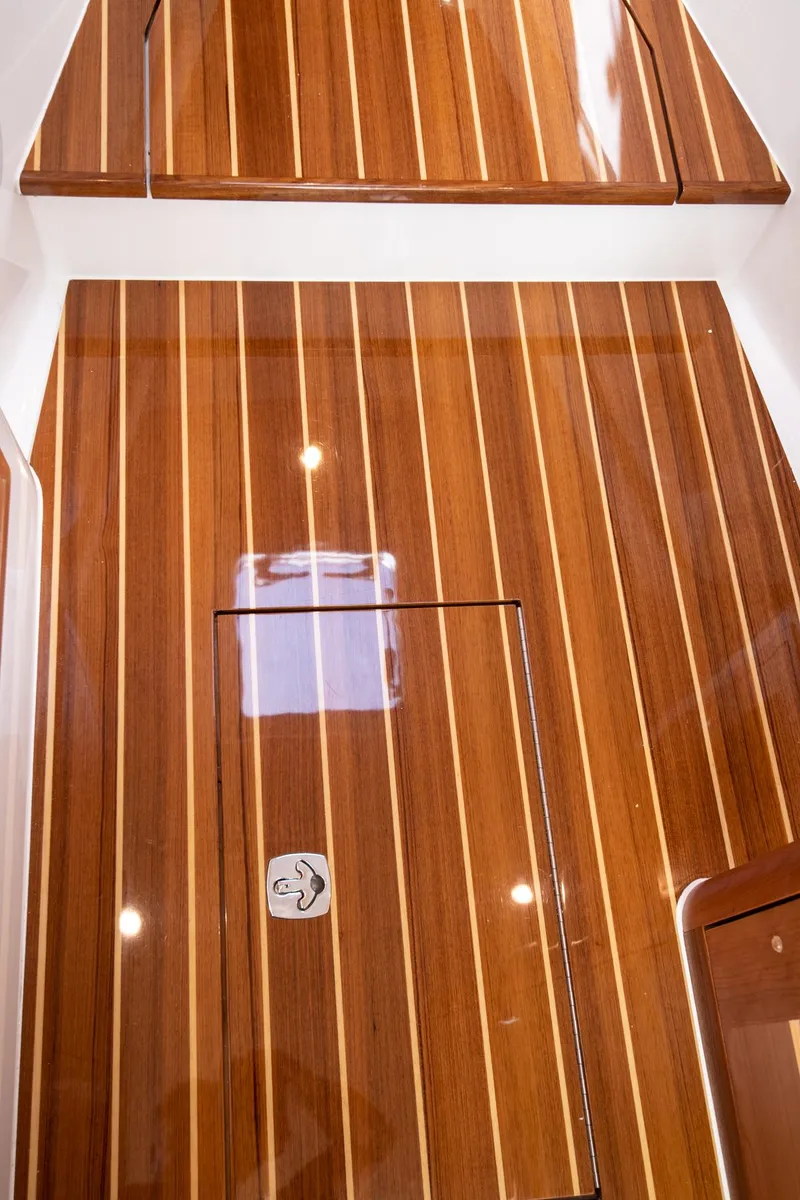 Slide: The Image of 2023 MJM 35 boat interior with polished wooden flooring. - 29