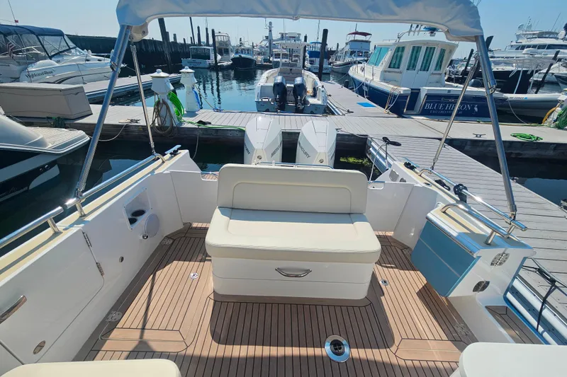 Slide: The Image of 2023 MJM 35 boat interior with seating, docked at marina. - 31