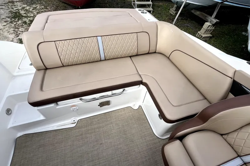 Slide: The Image of Luxurious seating on 2016 Sea Ray 220 Sundeck boat with beige upholstery and diamond stitching. - 17