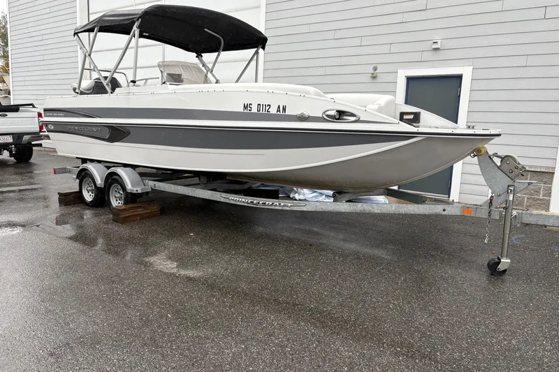 Slide: The Image of 2022 Princecraft Ventura 224 boat on trailer, parked outdoors on wet pavement. - 0