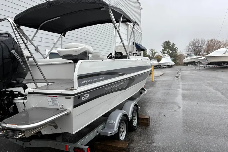 Slide: The Image of 2022 Princecraft Ventura 224 boat on trailer, parked outdoors on a rainy day. - 6