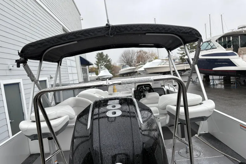 Slide: The Image of 2022 Princecraft Ventura 224 boat with canopy, parked near other boats. - 7