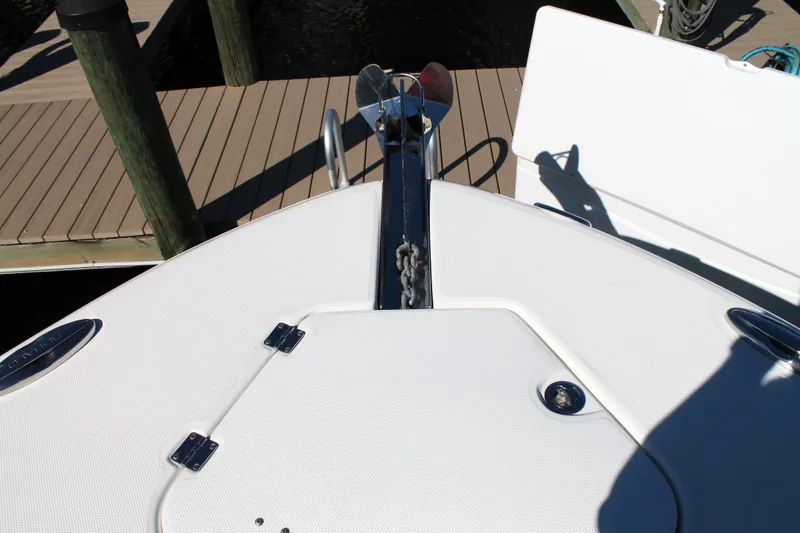 Slide: The Image of 2016 Robalo R300 Center Console boat bow with anchor and dock view. - 13