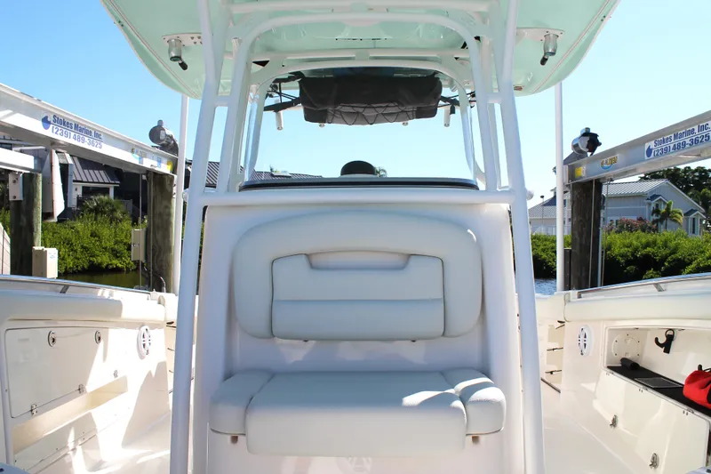 Slide: The Image of 2016 Robalo R300 Center Console boat interior with seating and storage. - 17