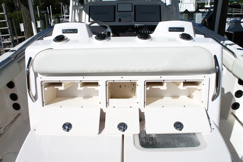 Slide: The Image of 2016 Robalo R300 Center Console boat with open storage compartments and Garmin electronics. - 30