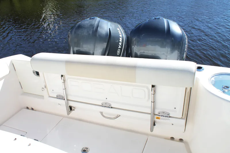 Slide: The Image of 2016 Robalo R300 Center Console boat with Yamaha engines on water. - 36