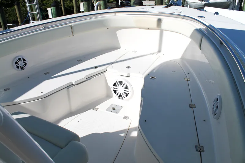 Slide: The Image of 2016 Robalo R300 Center Console boat interior with seating and speakers. - 9