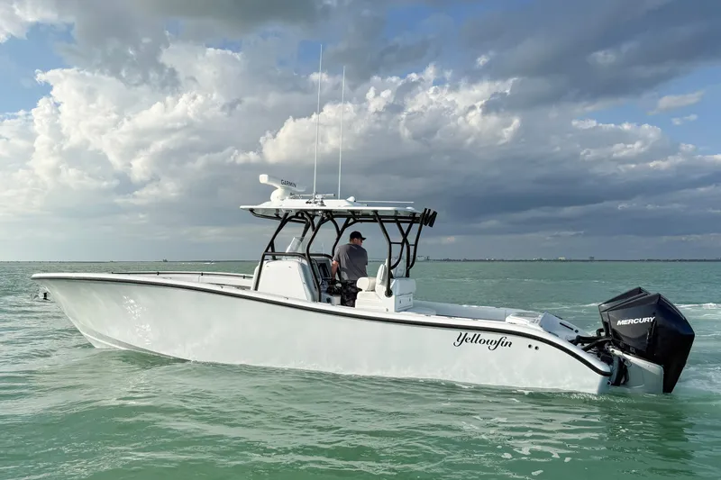 The Image of 2026 Yellowfin 34 Offshore boat on calm sea under cloudy sky. - 0