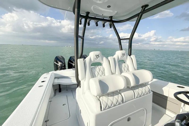 Slide: The Image of 2026 Yellowfin 34 Offshore boat with white seating on open water. - 15