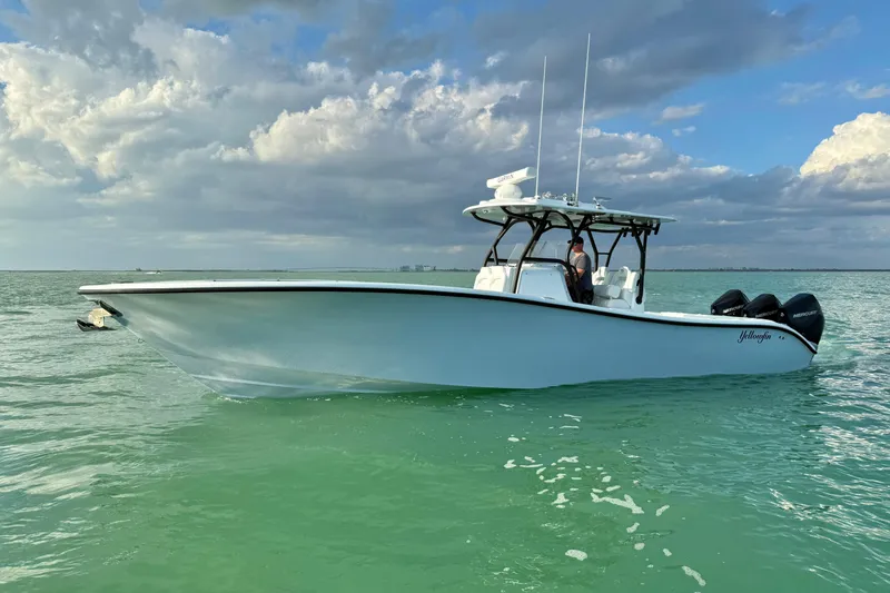 Slide: The Image of 2026 Yellowfin 34 Offshore boat on calm sea under cloudy sky. - 2