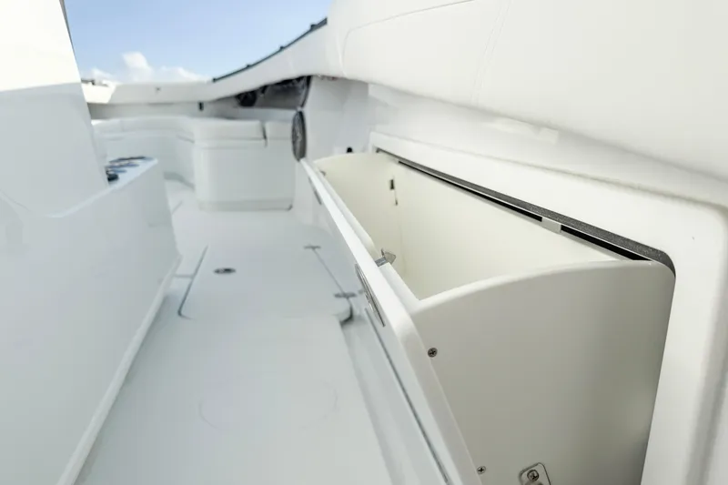 Slide: The Image of 2026 Yellowfin 34 Offshore boat interior with open storage compartment. - 21