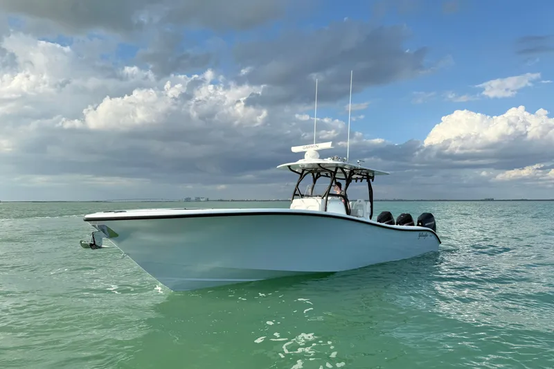 Slide: The Image of 2026 Yellowfin 34 Offshore boat cruising on open water with Mercury engines. - 3