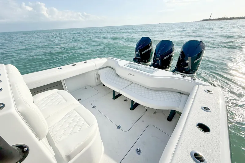 Slide: The Image of 2026 Yellowfin 34 Offshore boat with triple Mercury engines on open water. - 6