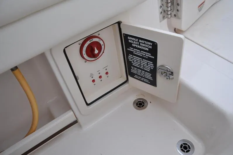 Slide: The Image of Battery switch panel on 2022 Grady-White Freedom 235 boat, featuring operation instructions. - 15