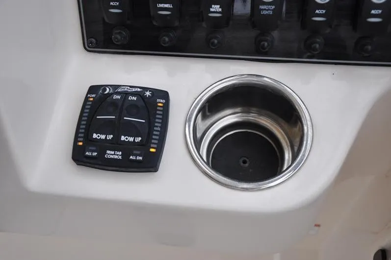 Slide: The Image of Control panel and cup holder on 2022 Grady-White Freedom 235 boat. - 22