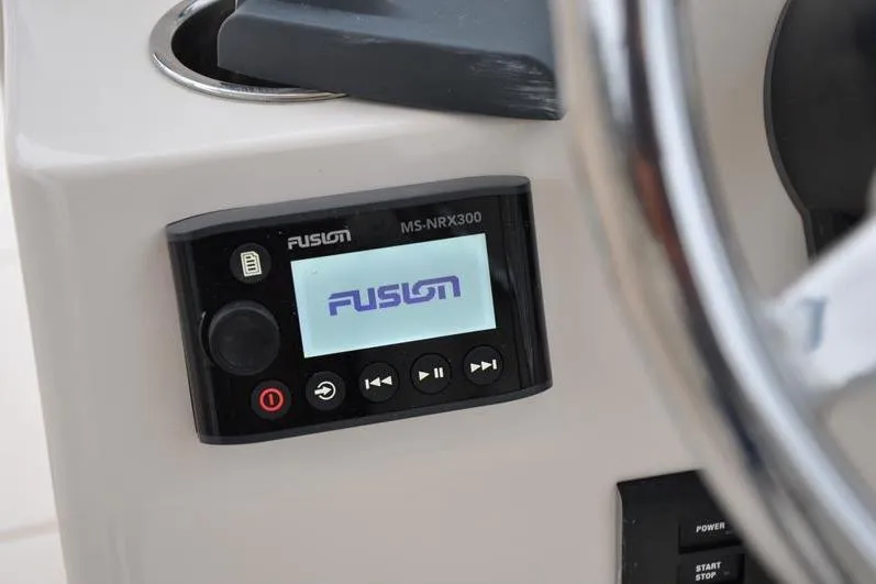 Slide: The Image of Fusion MS-NRX300 stereo system on 2022 Grady-White Freedom 235 boat dashboard. - 27