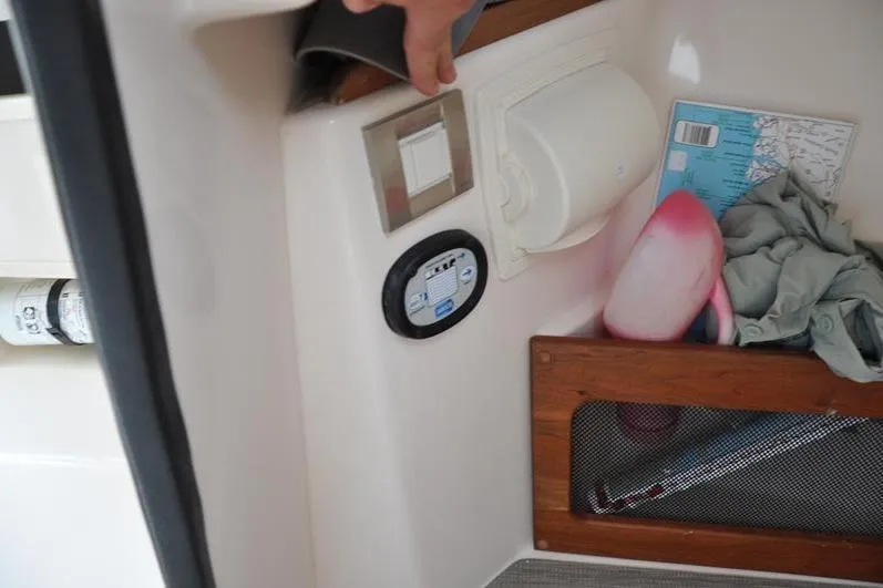 Slide: The Image of Interior of 2022 Grady-White Freedom 235 boat with storage compartment and control panel. - 29