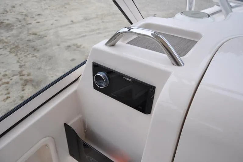 Slide: The Image of 2022 Grady-White Freedom 235 boat dashboard with Fusion audio system. - 30