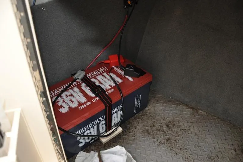 Slide: The Image of Battery compartment of 2022 Grady-White Freedom 235 with Dakota Lithium 36V battery. - 34