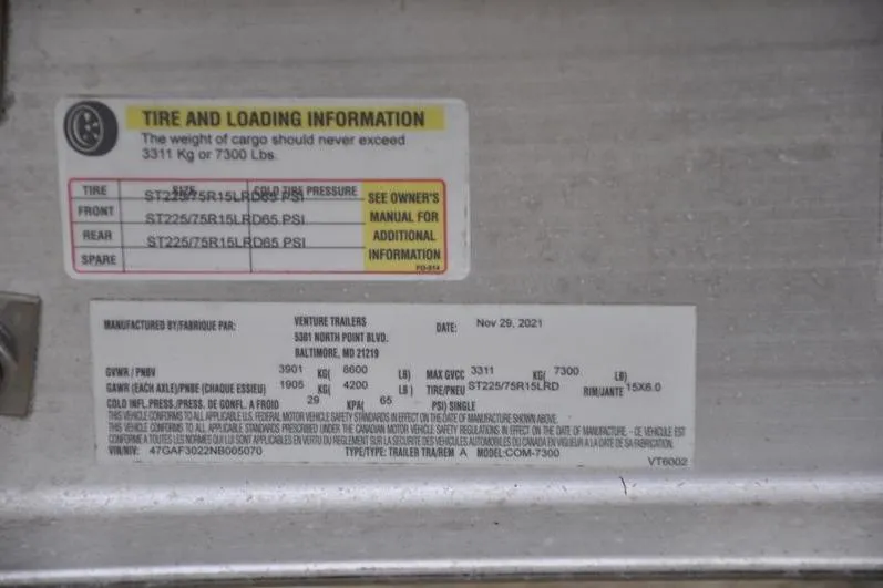 Slide: The Image of Tire and loading information label for 2022 Grady-White Freedom 235 boat trailer. - 38