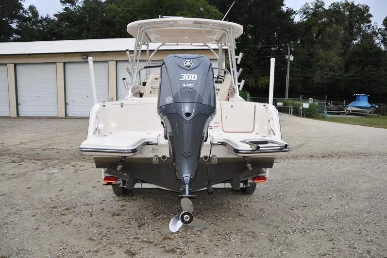 Slide: The Image of 2022 Grady-White Freedom 235 boat with Yamaha 300 V6 engine, parked outdoors. - 4