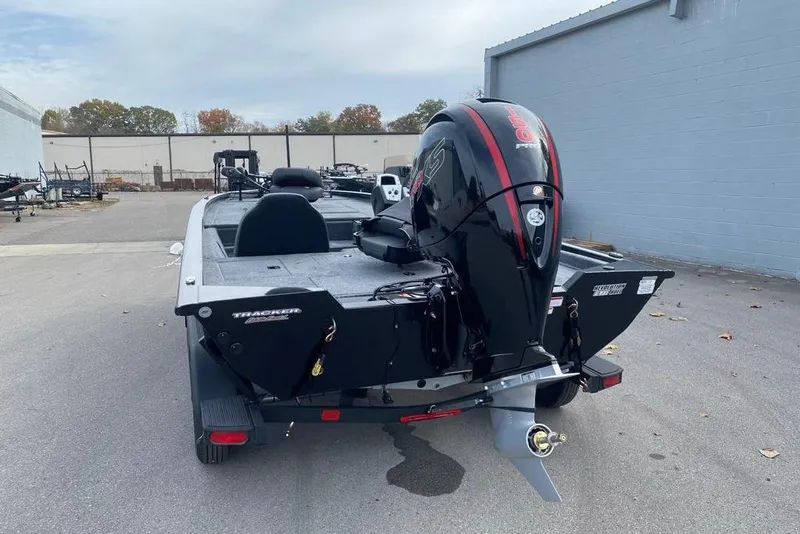 Slide: The Image of 2026 Tracker Pro Team 195 boat with powerful outboard motor, parked outdoors. - 61