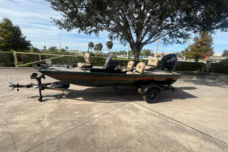 The Image of 2026 Tracker Bass Tracker Classic Limited boat on trailer, parked outdoors under a tree. - 0