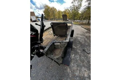 Slide: The Image of 2026 Tracker Grizzly 1650 T Prairie Wings Edition boat on a trailer, outdoor setting. - 4