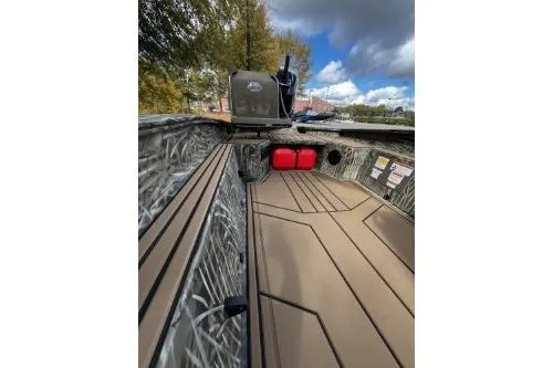 Slide: The Image of 2026 Tracker Grizzly 1650 T Prairie Wings Edition boat interior with camouflage design. - 5