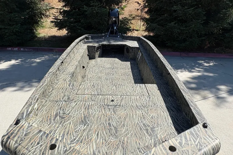 Slide: The Image of 2026 Tracker Grizzly 1650 T Prairie Wings Edition boat with camouflage design. - 15