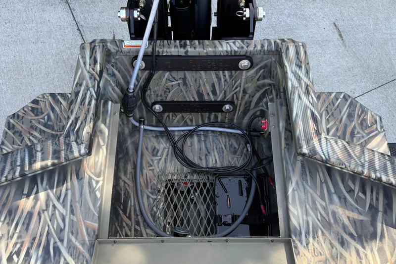 Slide: The Image of 2026 Tracker Grizzly 1650 T Prairie Wings Edition boat interior with camouflage design. - 18
