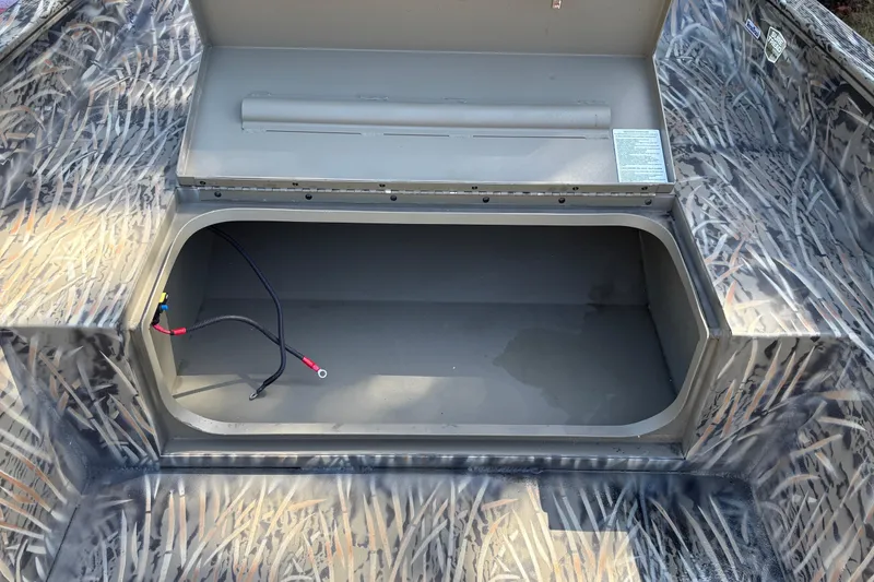 Slide: The Image of Open storage compartment in 2026 Tracker Grizzly 1650 T Prairie Wings Edition boat. - 25