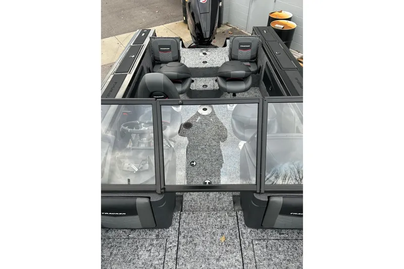Slide: The Image of 2026 Tracker Targa V-19 Combo boat interior with seating and steering console. - 7