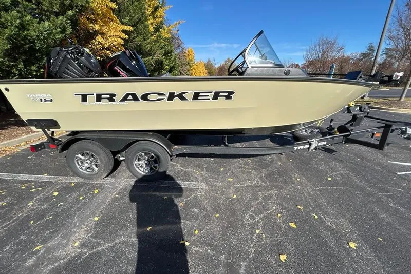 The Image of 2026 Tracker Targa V-19 Combo boat on trailer, parked outdoors. - 0