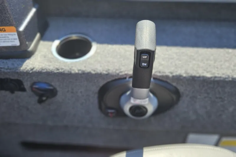 Slide: The Image of Throttle control lever on a 2026 Tahoe T21 boat dashboard. - 91