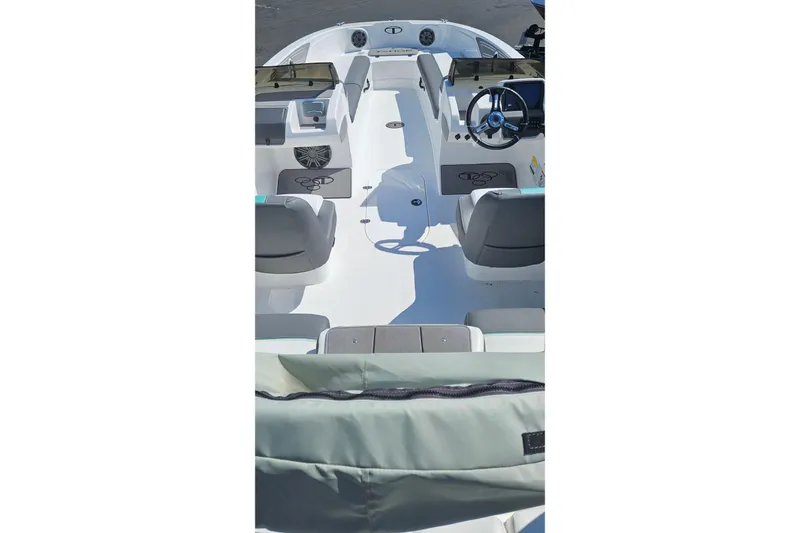 Slide: The Image of 2026 Tahoe T21 boat interior with steering wheel and seating arrangement. - 87
