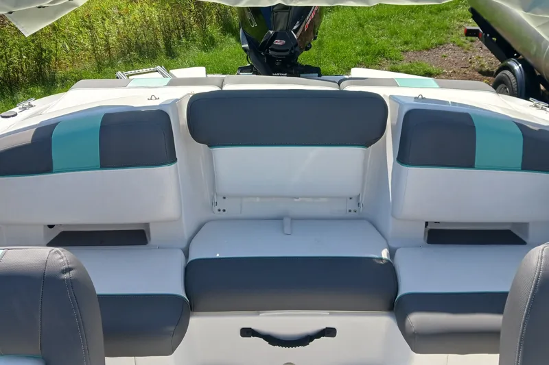Slide: The Image of 2026 Tahoe T21 boat interior with gray and teal seating, showcasing modern design. - 9