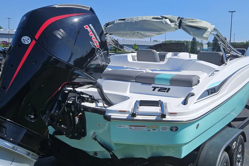 Slide: The Image of 2026 Tahoe T21 boat with Mercury Pro XS engine, featuring sleek design and comfortable seating. - 86